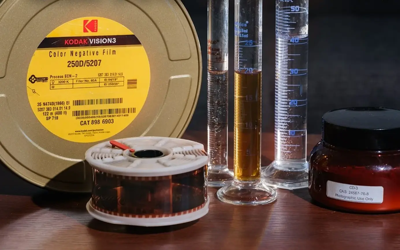 Film canister, developing chemistry, and a reel of motion-picture film